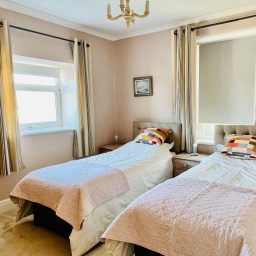 Twin or super-king bedroom with hill view