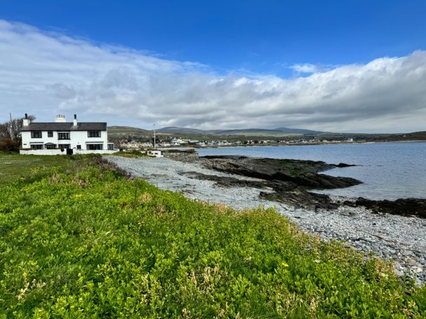 Gansey point showing old cottage nestled in the landscape